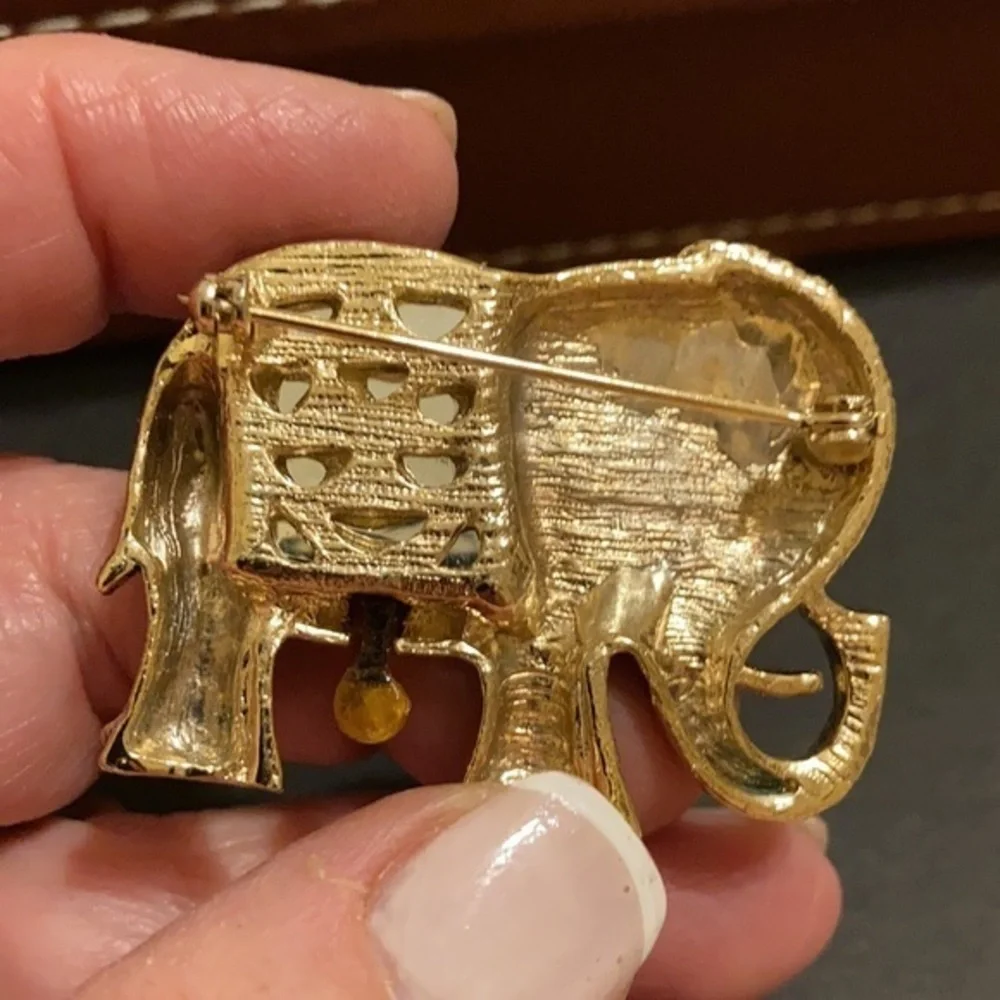 Gorgeous gold tone and crystal elephant brooch
